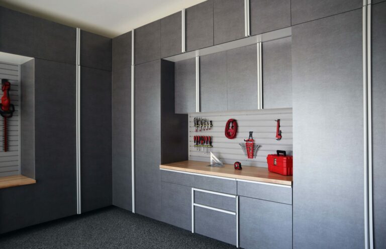 Pewter-Cabinets-with-Butcher-Block-Countertop-and-Grey-Slatwall-Closeup-Angle-June-2021-scaled